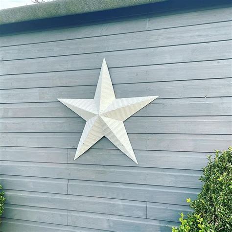 why do people put metal stars on their house|metal stars on american house.